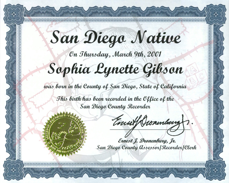 Certificate with blue decorative border, gold seal, "San Diego Native" at the top, with name, locations, date, and signature of the County Clerk