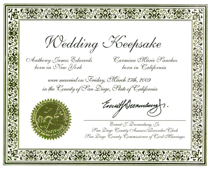 Certificate with gold decorative border, gold seal, "Wedding Keepsake" at the top, with names, locations, date, and signature of the County Clerk/Commissioner of Civil Marriages